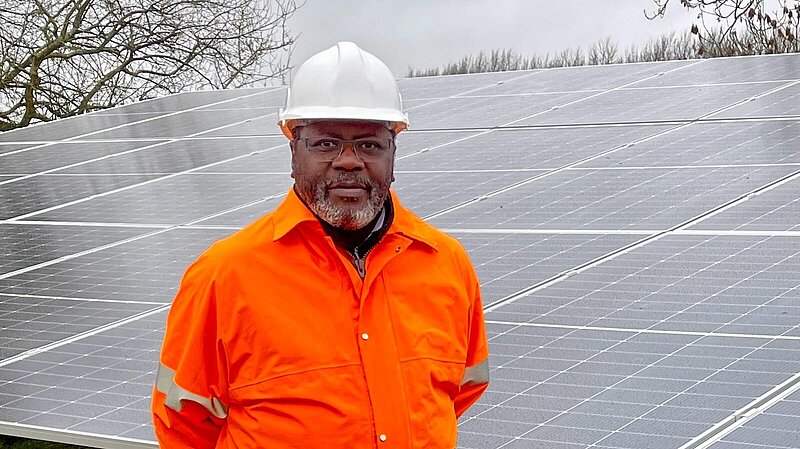 Lib Dem Ade Adeyemo at a solar farm
